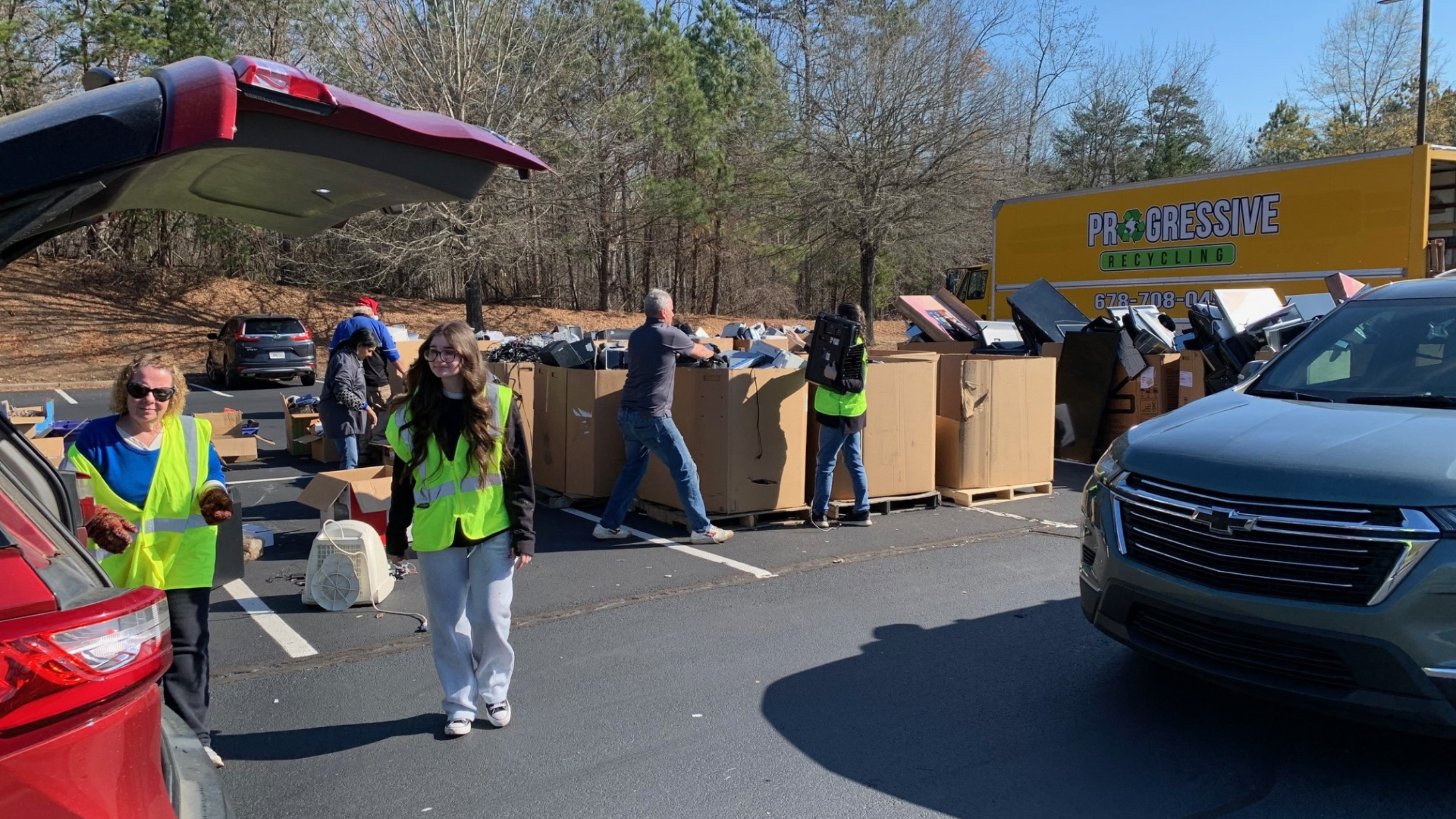 Volunteer unloading donated items into bins 